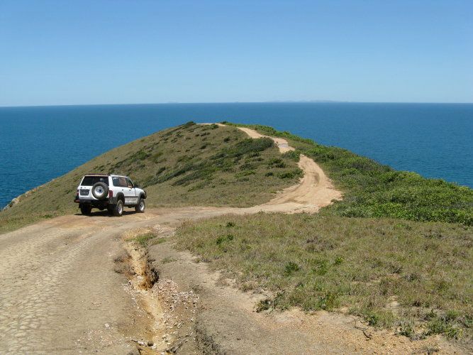Five Rocks Headland and Beach Driving down the hill to the Stockyard Point Lookout. From here you can look north to the Five Rocks Headland or south over Nine Miles Beach.