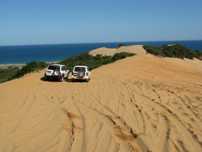 Five Rocks Headland and Beach The Orange Bowl - or so it called by locals. This gigantic pile of orange sand is a great place to rev up the 'ol 4WD and spin some wheels, but be wary of burning out your motor.